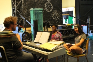 (From left) Musical Director Jordan Cooper works with Side Show twins CoCo Smith and Erin Sheplavy at a June 2013 rehearsal.